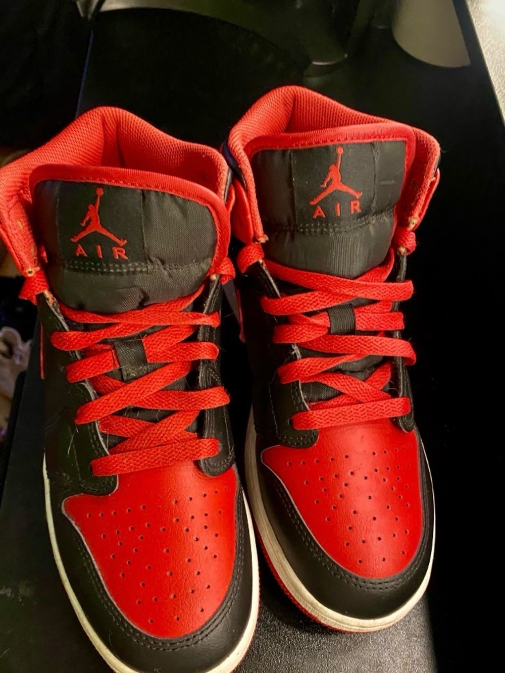 Jordan Woman’s High-Top Sneakers in Red & Black